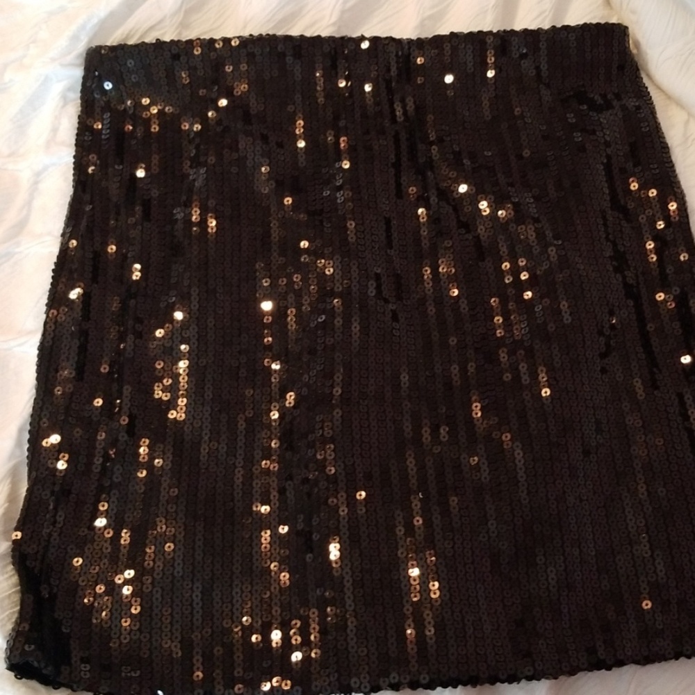 Black sequined skirt.